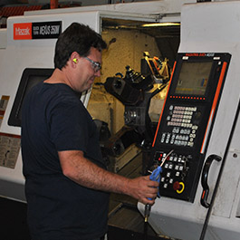 picture of a machinist working on a Mazak Nexus 350 CNC machine at Silverado Oil Tools
