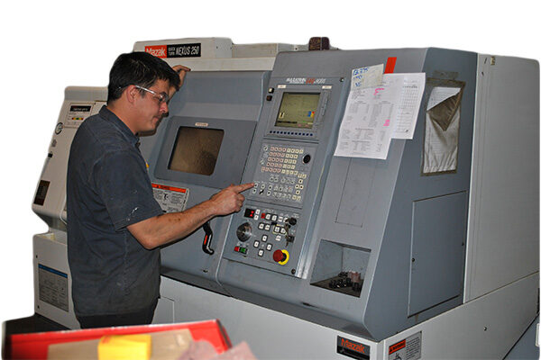 CNC Machinist working on Mazak Nexus 250 CNC Lathe at Silverado Oil Tools